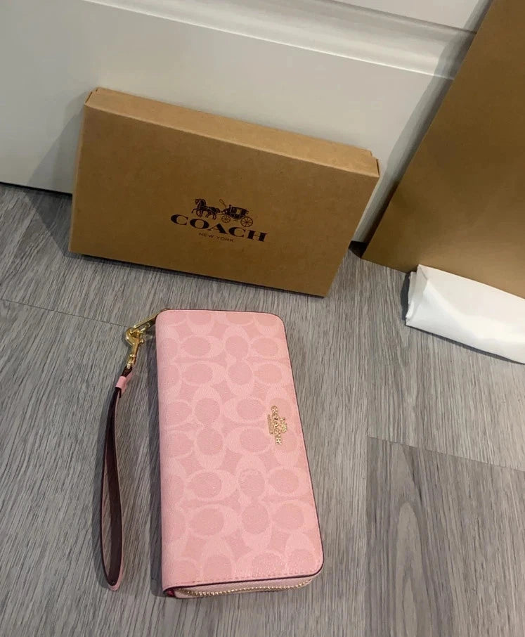 Coach Signature Canvas Zip-Around Wallet Pink